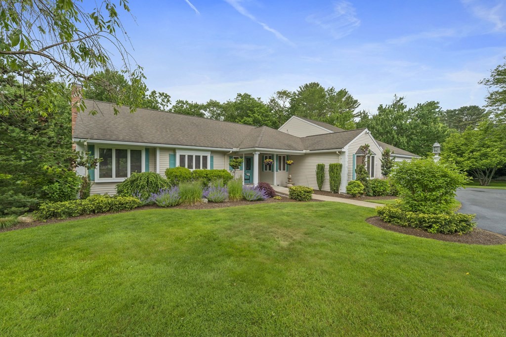 121 Setterland Farm Road Hanover, MA 02339 - Photo 28 of 33 a front view of a house with a garden