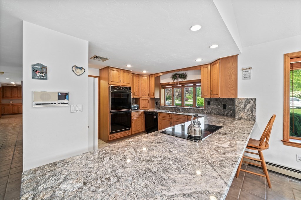 121 Setterland Farm Road Hanover, MA 02339 - Photo 3 of 33 a kitchen with stainless steel appliances granite countertop a refrigerator and a sink