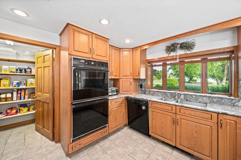 121 Setterland Farm Road Hanover, MA 02339 - Photo 4 of 33 a kitchen with stainless steel appliances granite countertop a refrigerator and a sink