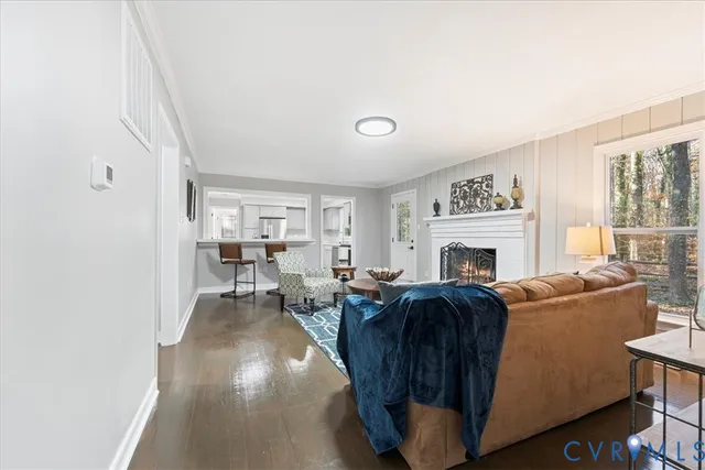 a kitchen with stainless steel appliances kitchen island hardwood floor and sink