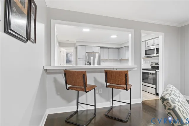 a view of a kitchen with a table and chairs