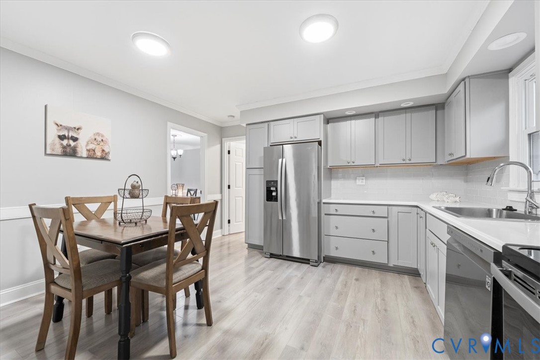 13700 Quail Meadows Lane Midlothian, VA 23112 - Photo 16 of 30 a view of a kitchen with a table and chairs
