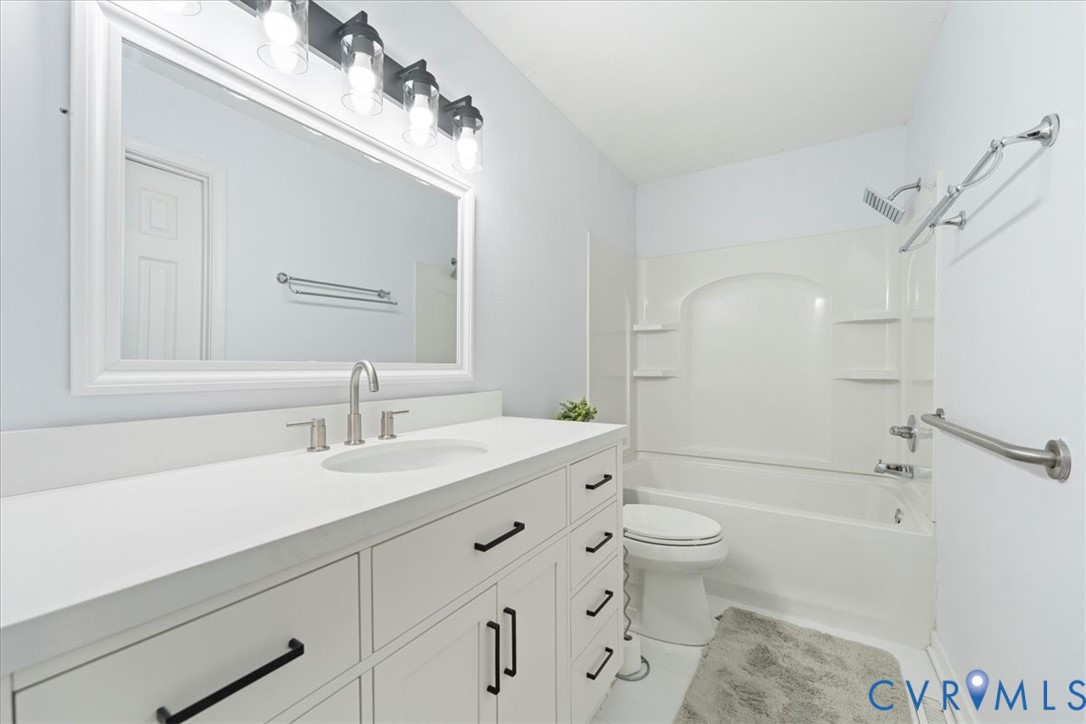 13700 Quail Meadows Lane Midlothian, VA 23112 - Photo 20 of 30 a bathroom with a sink a toilet and a mirror