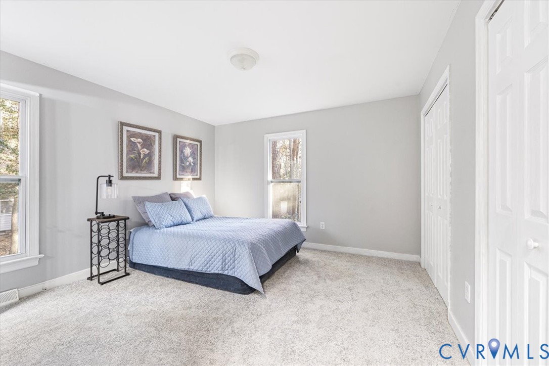 13700 Quail Meadows Lane Midlothian, VA 23112 - Photo 25 of 30 a spacious bedroom with a bed and a window
