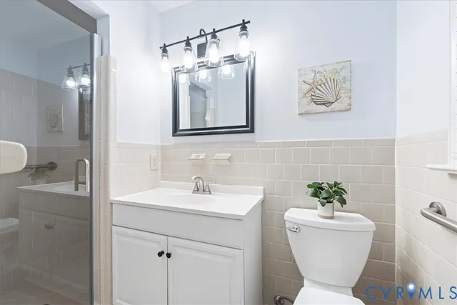 a bathroom with a shower and a sink