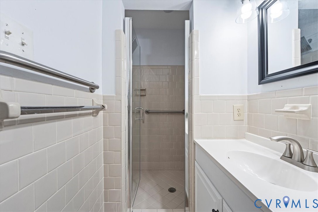 13700 Quail Meadows Lane Midlothian, VA 23112 - Photo 28 of 30 a bathroom with a shower and a sink