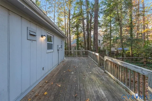 a view of a house with wooden deck
