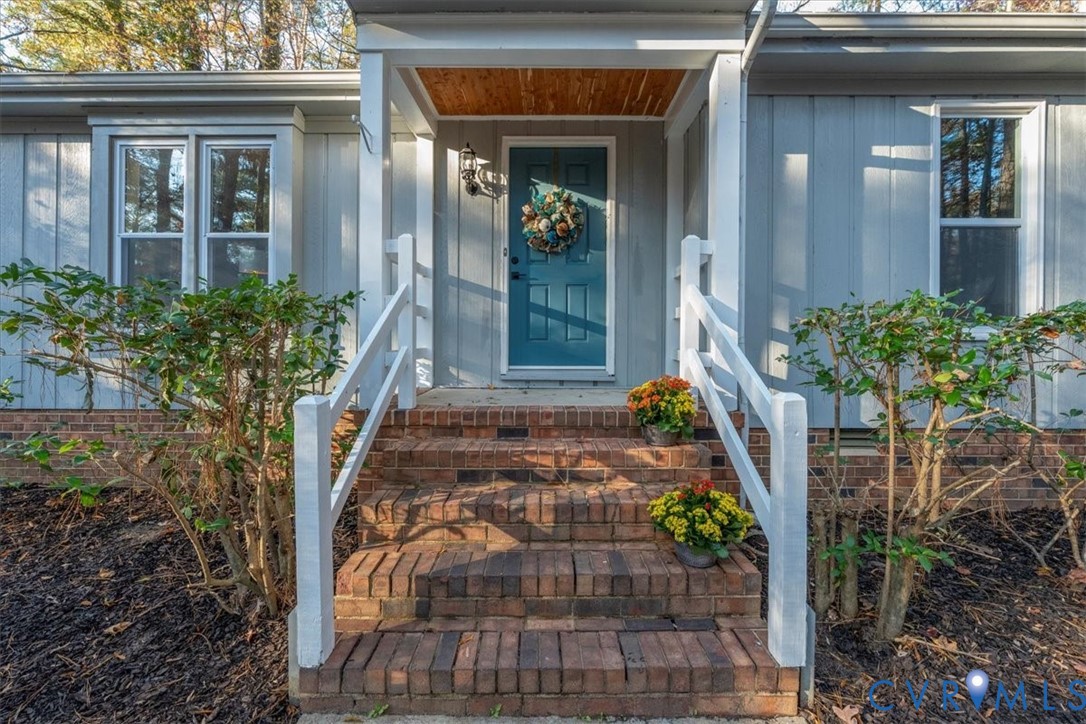 13700 Quail Meadows Lane Midlothian, VA 23112 - Photo 4 of 30 a front view of a house with a yard