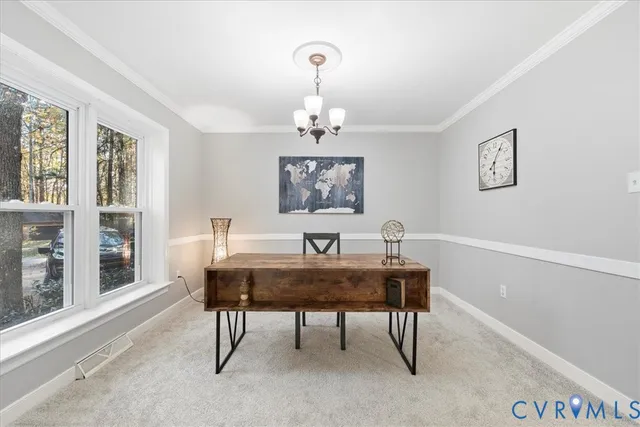 a view of a dining room with furniture and window