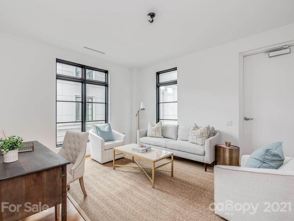 1333 Queens Road, Unit B4 Charlotte, NC 28207 - Photo 19 of 27 a living room with furniture and wooden floor