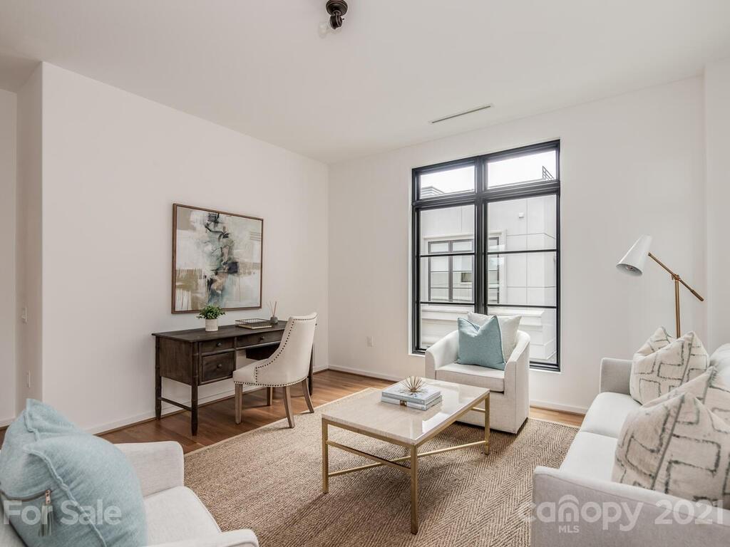 1333 Queens Road, Unit B4 Charlotte, NC 28207 - Photo 20 of 27 a living room with furniture and a window
