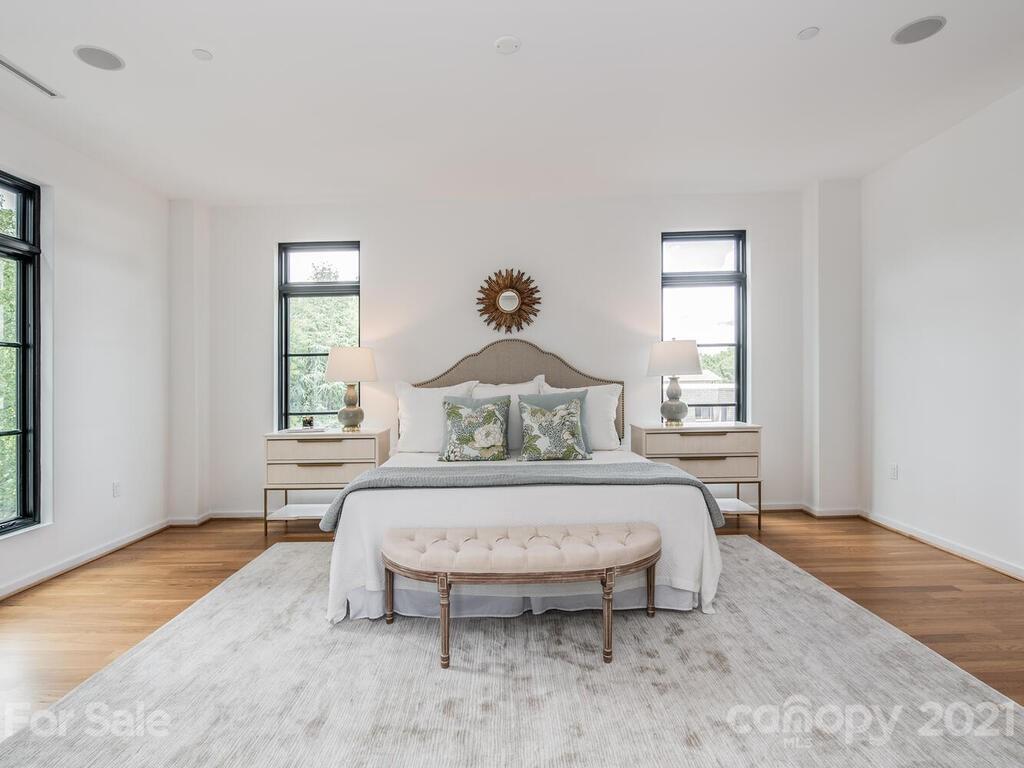 1333 Queens Road, Unit B4 Charlotte, NC 28207 - Photo 21 of 27 a spacious bedroom with a bed and window