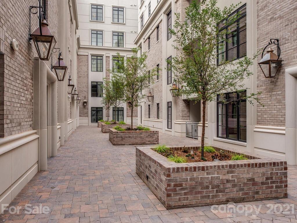 1333 Queens Road, Unit B4 Charlotte, NC 28207 - Photo 27 of 27 a front view of a house with yard fire pit and outdoor seating