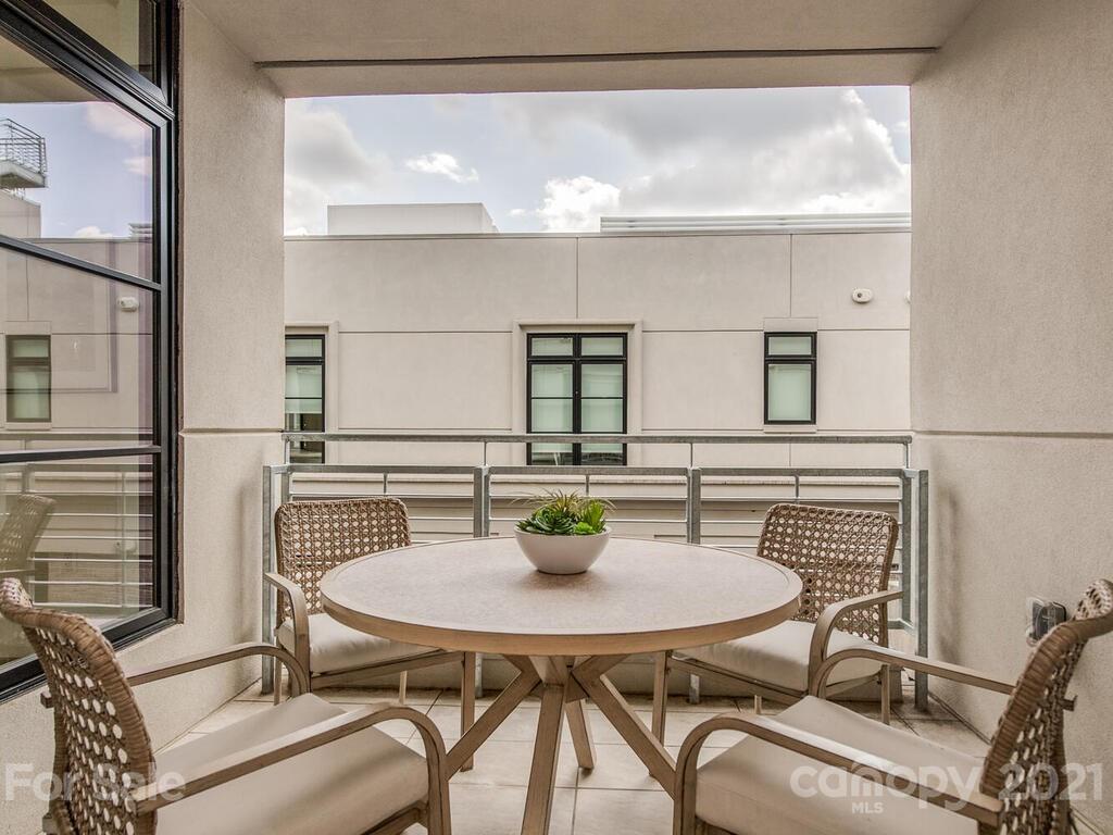 1333 Queens Road, Unit B4 Charlotte, NC 28207 - Photo 9 of 27 a view of a dining room with furniture and window