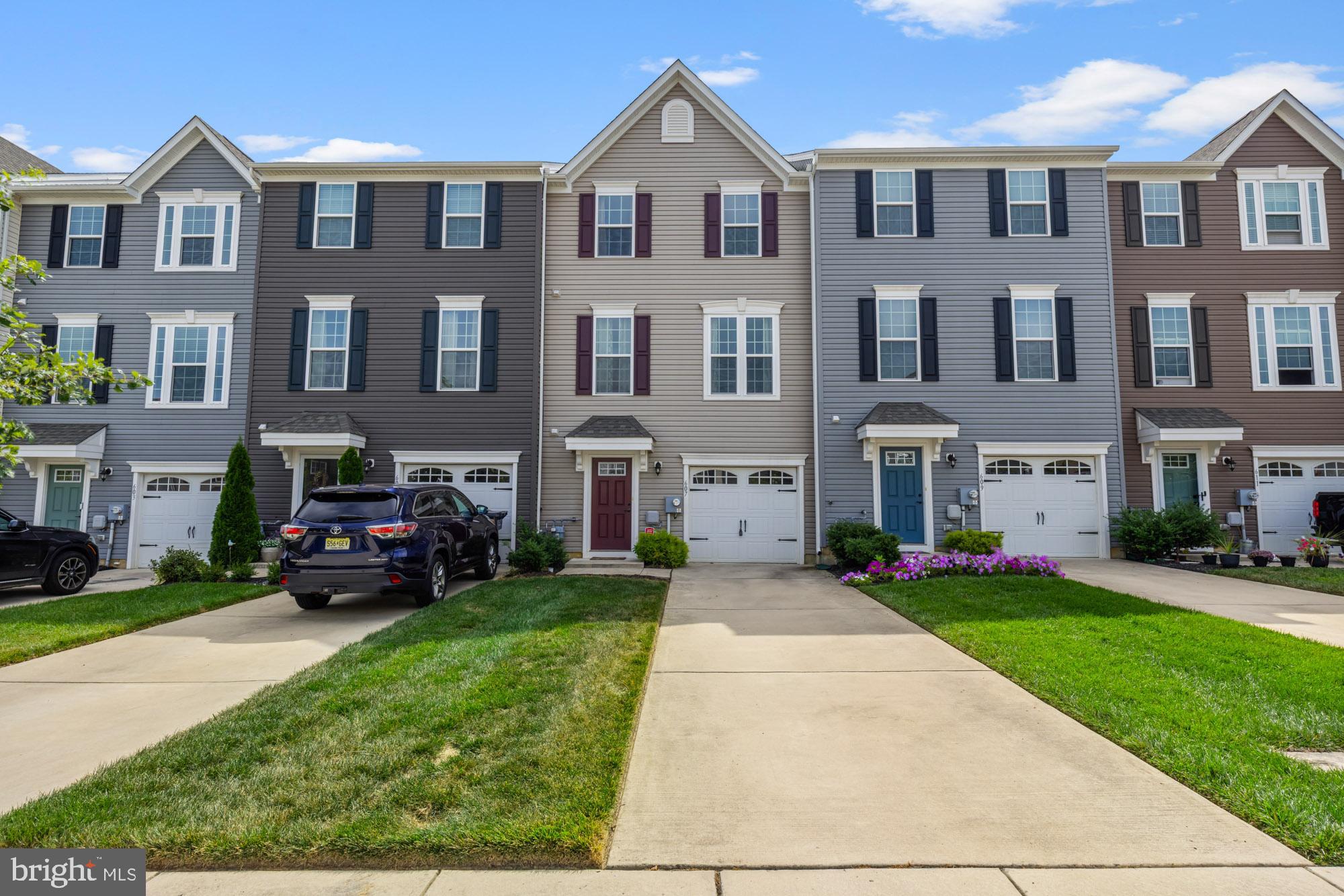 a car parked in front of a brick house