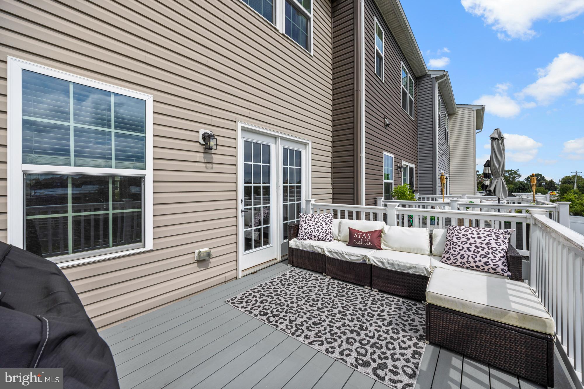 607 Sammy Street Swedesboro, NJ 08085 - Photo 21 of 37 a balcony with couches and wooden floor