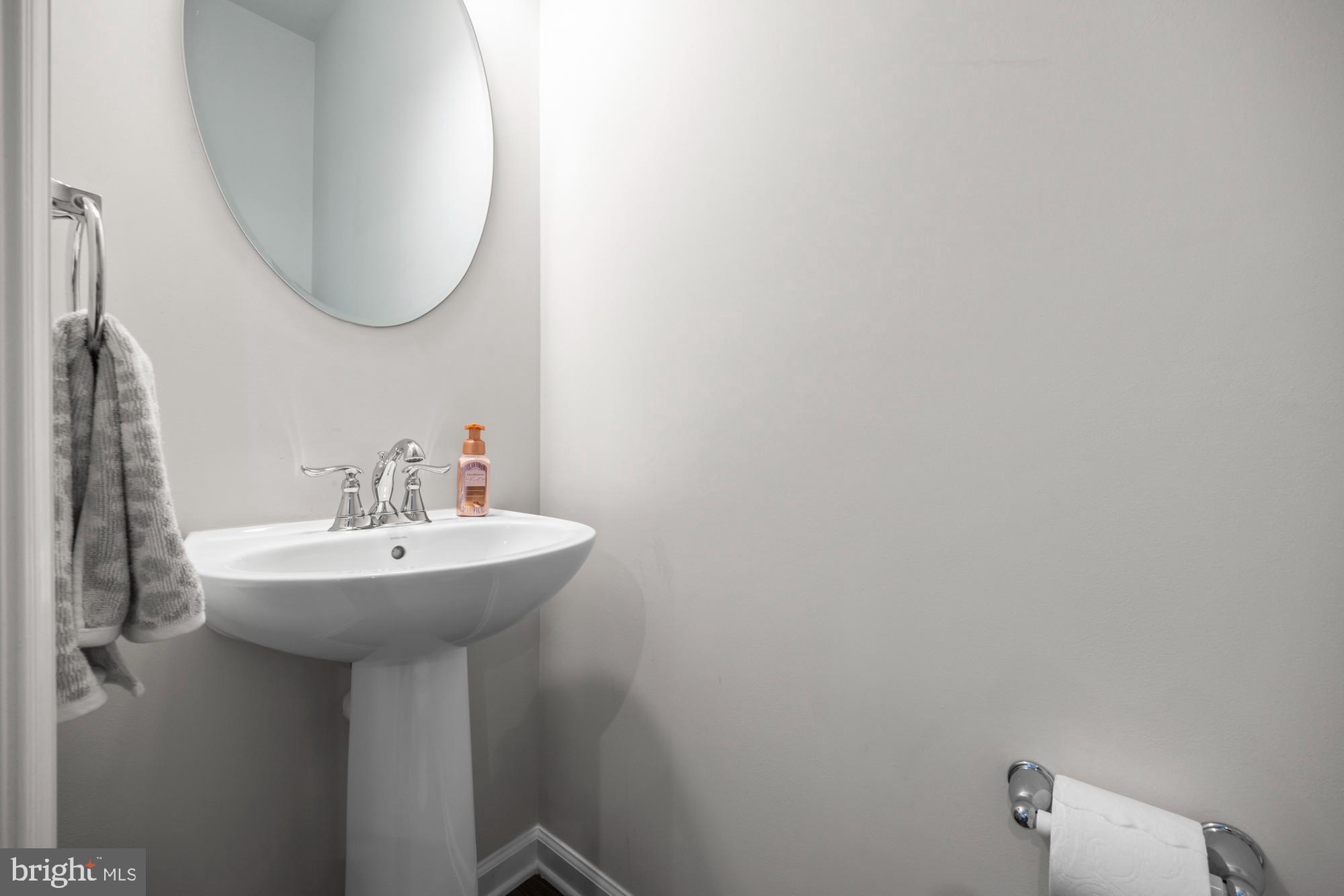 607 Sammy Street Swedesboro, NJ 08085 - Photo 22 of 37 a bathroom with a sink a mirror and a toilet