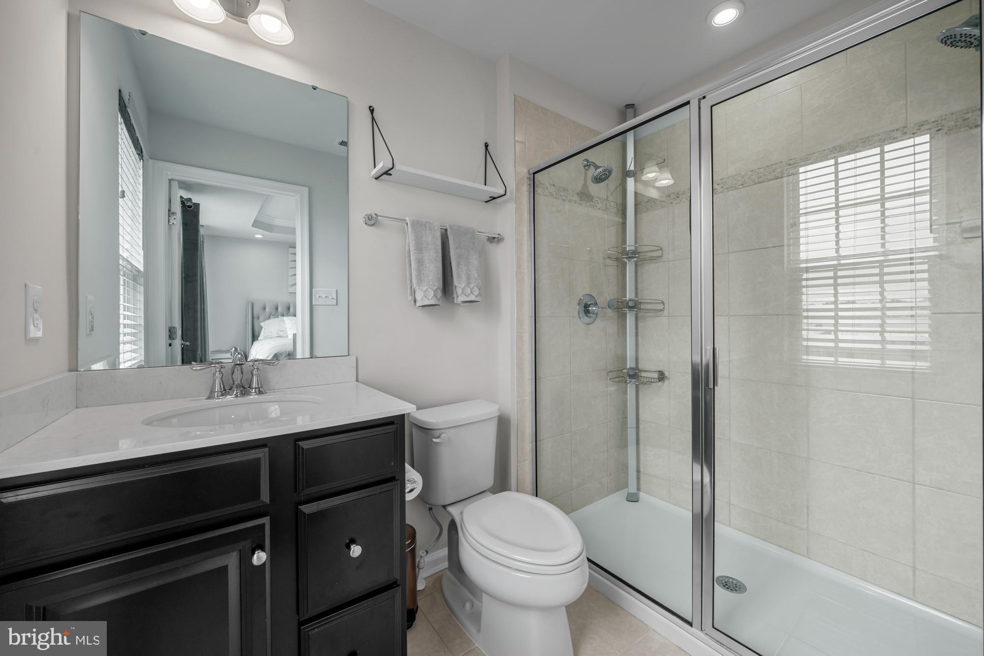 607 Sammy Street Swedesboro, NJ 08085 - Photo 25 of 37 a bathroom with a granite countertop sink toilet and shower