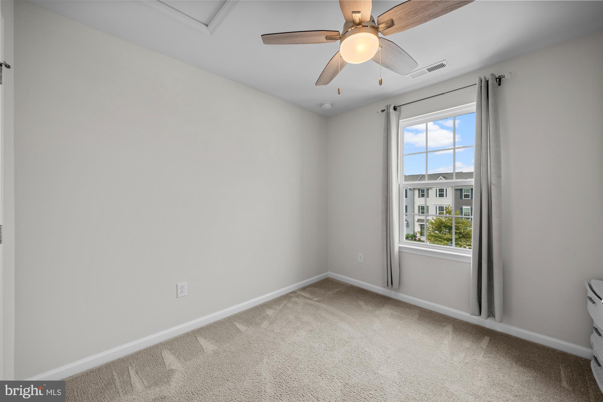 607 Sammy Street Swedesboro, NJ 08085 - Photo 27 of 37 an empty room with windows and chandelier fan