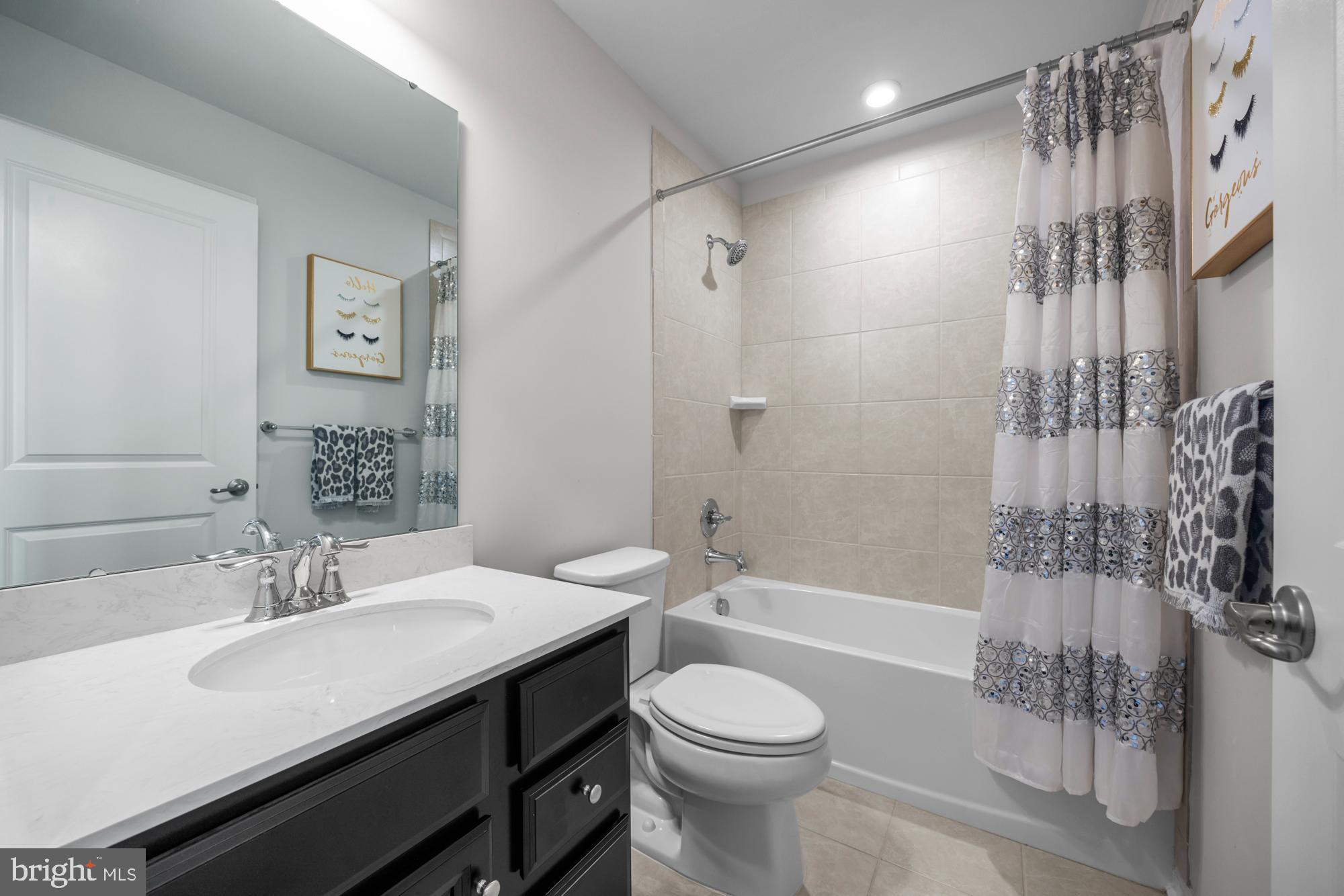 607 Sammy Street Swedesboro, NJ 08085 - Photo 28 of 37 a bathroom with a sink a toilet a mirror and shower