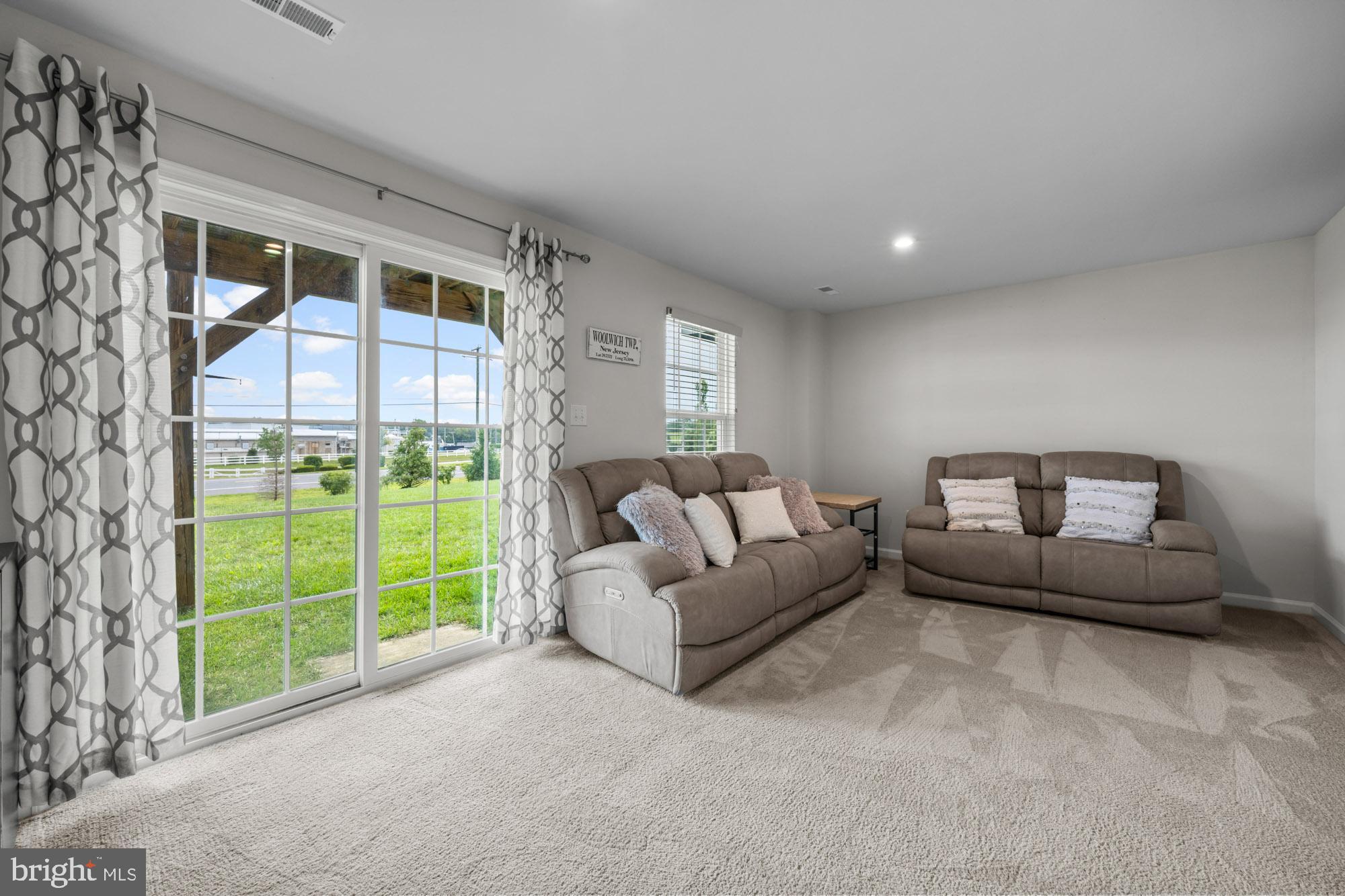 607 Sammy Street Swedesboro, NJ 08085 - Photo 4 of 37 a living room with furniture and a garden