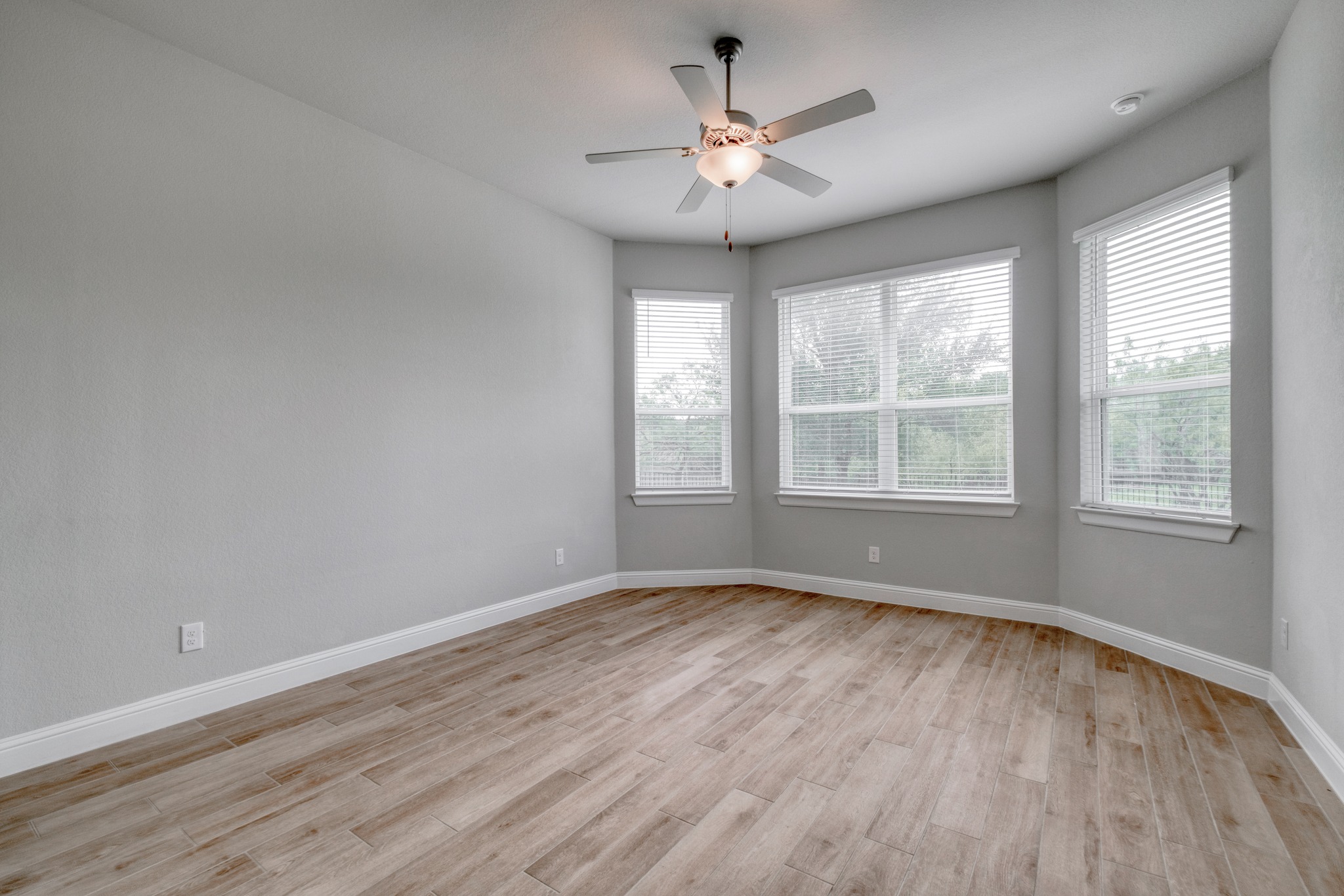 359 Raptor Beak Way Cedar Creek, TX 78612 - Photo 16 of 29 Positioned at the back of the home for maximum privacy, the primary bedroom offers a peaceful view of your private acre of land
