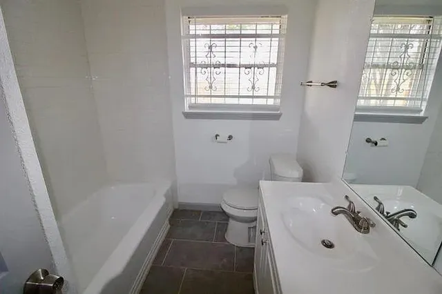 a bathroom with a sink and a bathtub