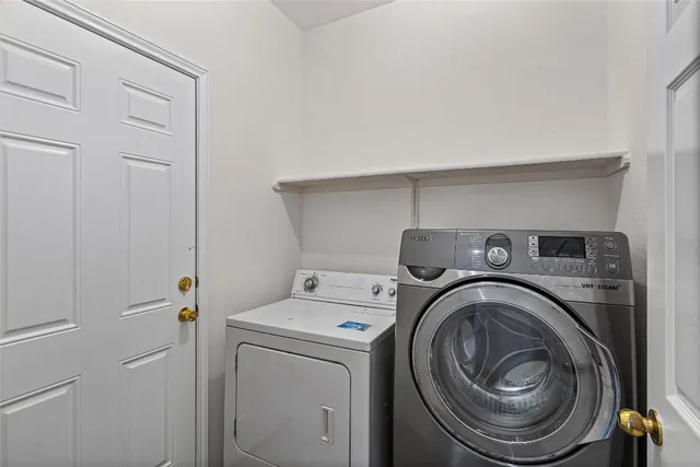 a utility room with dryer and washer
