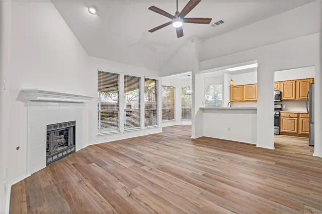 a view of livingroom with hardwood floor and a ceiling fan