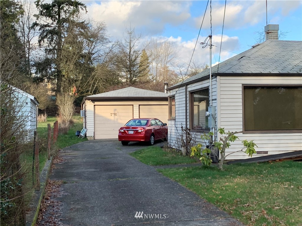 912 Southwest 3rd Place Renton, WA 98057 - Photo 2 of 20 a view of a house with a yard and sitting area