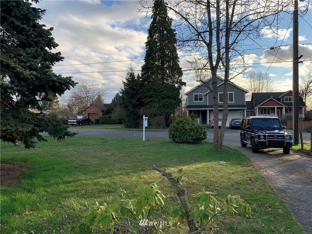 912 Southwest 3rd Place Renton, WA 98057 - Photo 20 of 20 a view of a house with a cars park side of a road