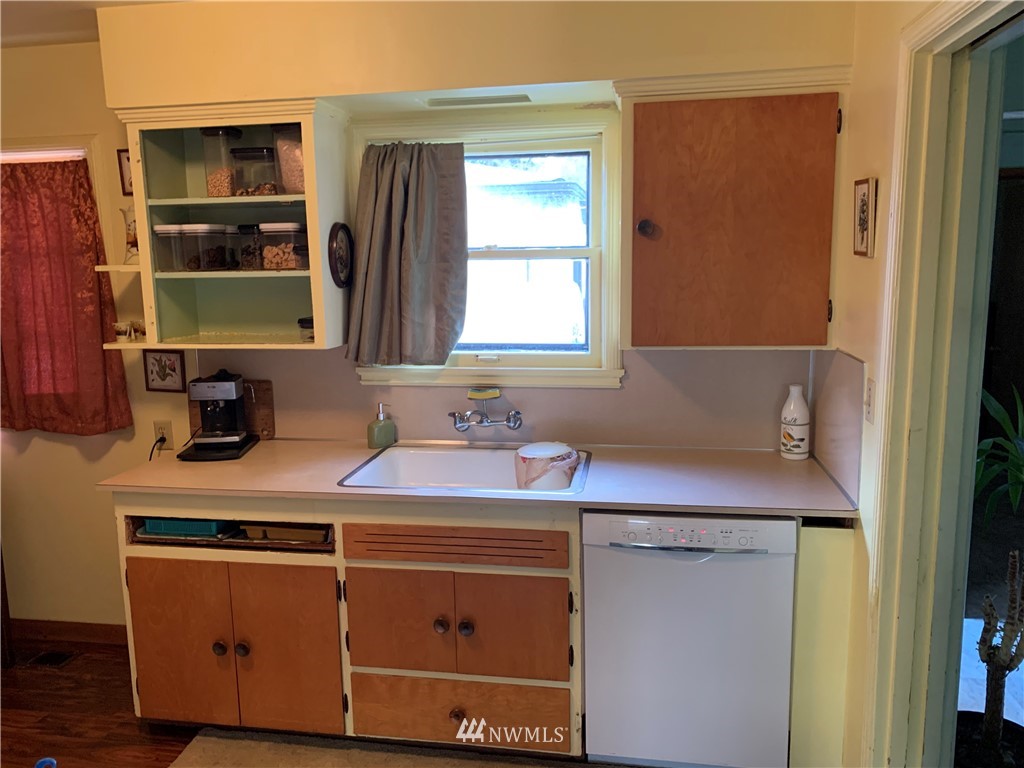 912 Southwest 3rd Place Renton, WA 98057 - Photo 9 of 20 a room with a sink cabinets and a window