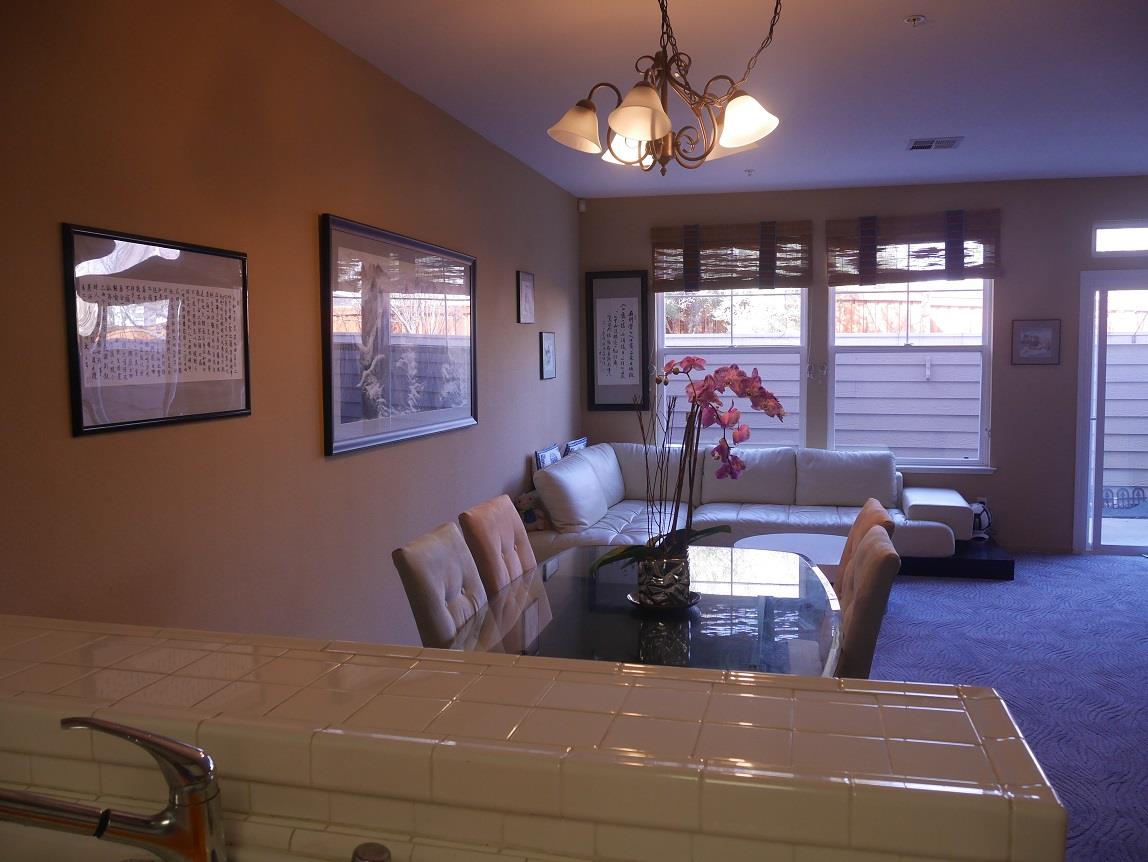 130 Sutter Creek Lane San Ramon, CA 94583 - Photo 4 of 10 a living room with fireplace furniture and a chandelier