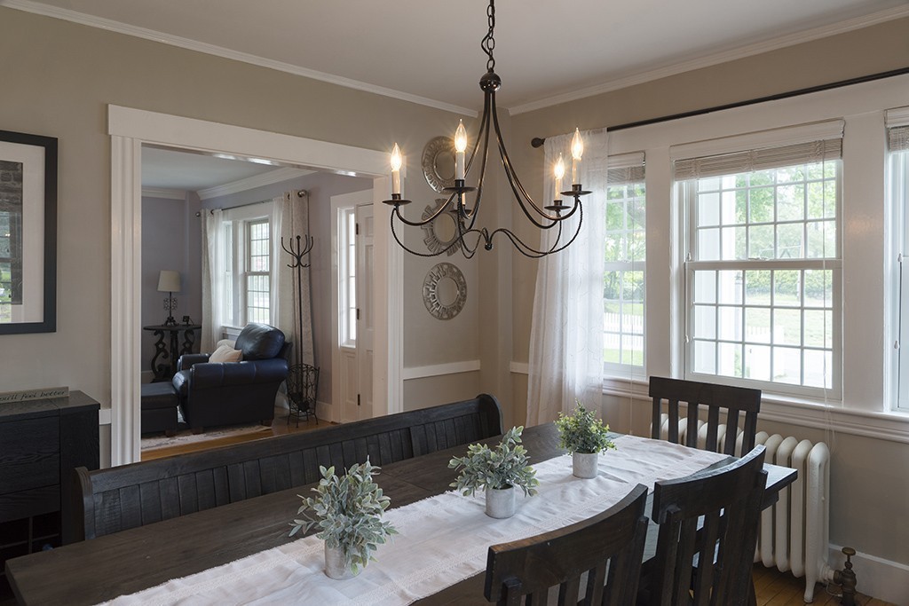 5 Hidden Road Andover, MA 01810 - Photo 14 of 30 a view of a dining room with furniture wooden floor livingroom and chandelier