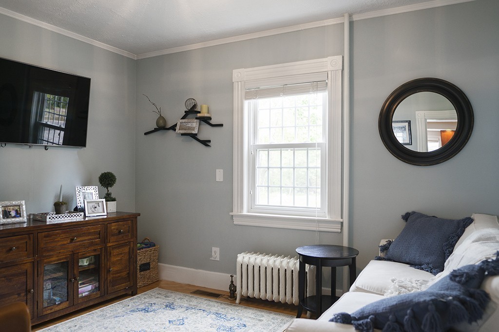 5 Hidden Road Andover, MA 01810 - Photo 9 of 30 a bedroom with a bed and a window
