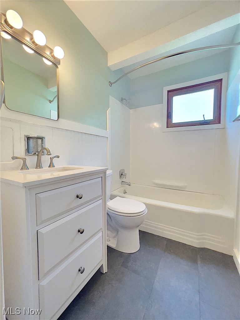 24000 Knickerbocker Road Bay Village, OH 44140 - Photo 15 of 27 Full bathroom with vanity, tile floors, shower combination, and toilet