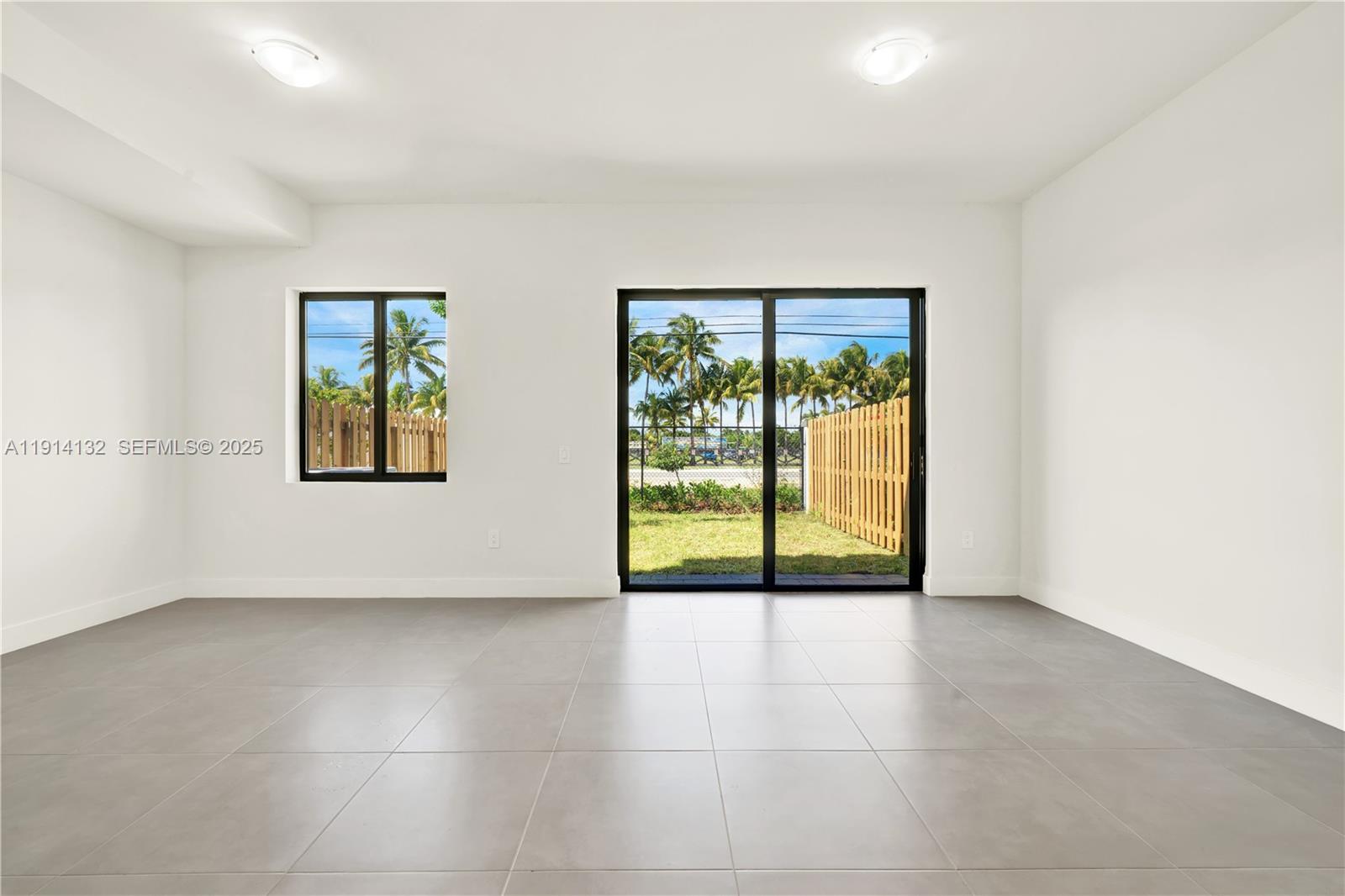 34520 Southwest 191st Court, Unit 34520 Homestead, FL 33034 - Photo 13 of 37 an empty room with windows