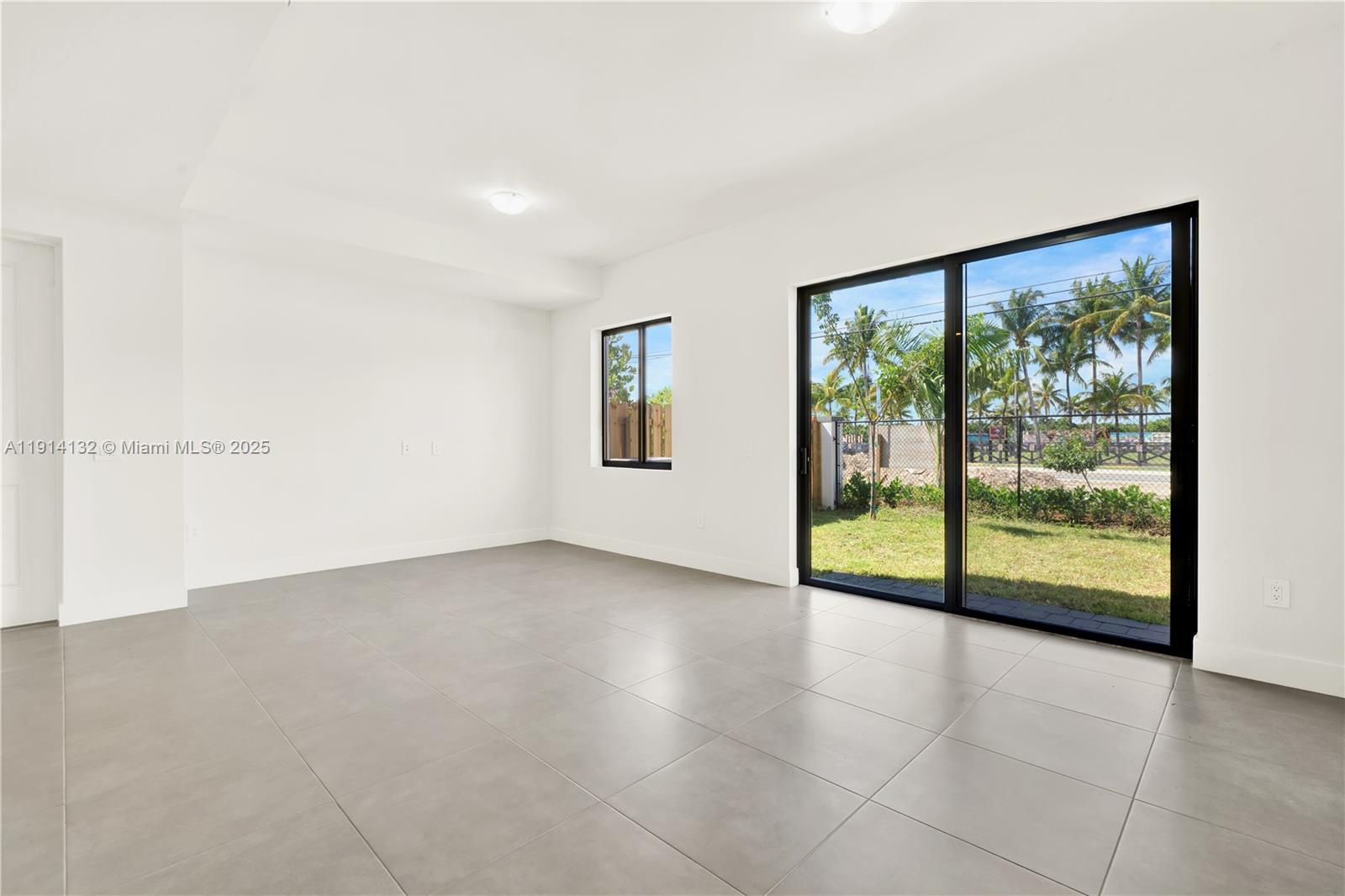 34520 Southwest 191st Court, Unit 34520 Homestead, FL 33034 - Photo 14 of 37 a view of an empty room with a window