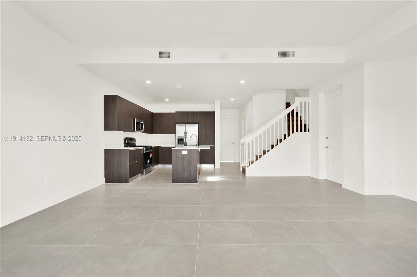 34520 Southwest 191st Court, Unit 34520 Homestead, FL 33034 - Photo 15 of 37 a view of kitchen with furniture and cabinets
