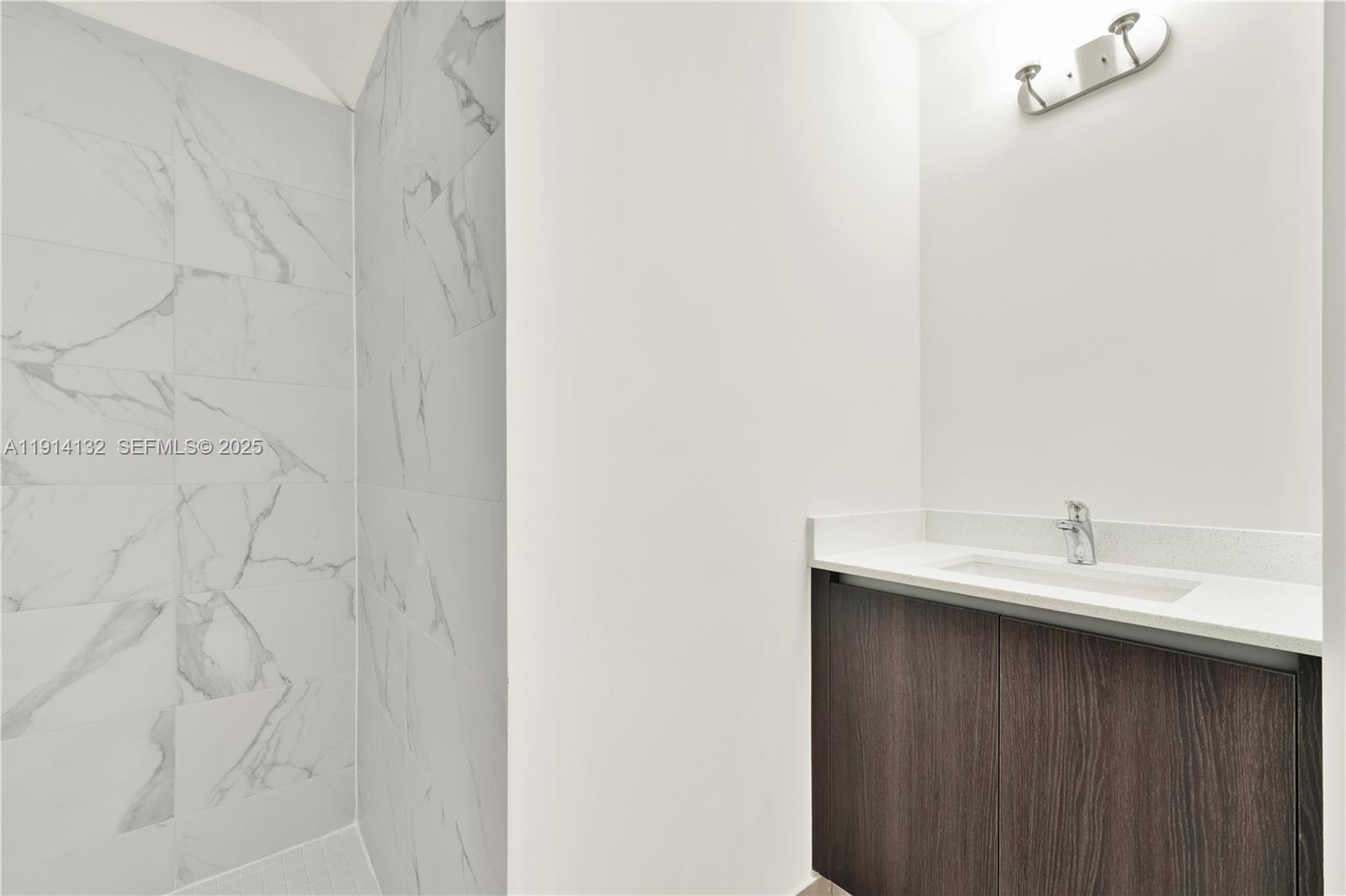 34520 Southwest 191st Court, Unit 34520 Homestead, FL 33034 - Photo 20 of 37 a bathroom with a sink and a mirror