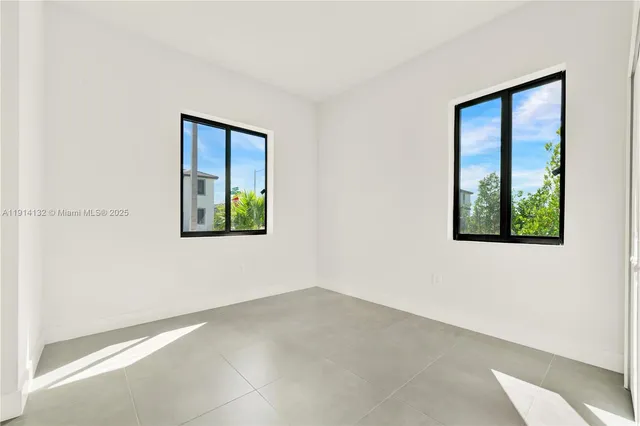 an empty room with windows