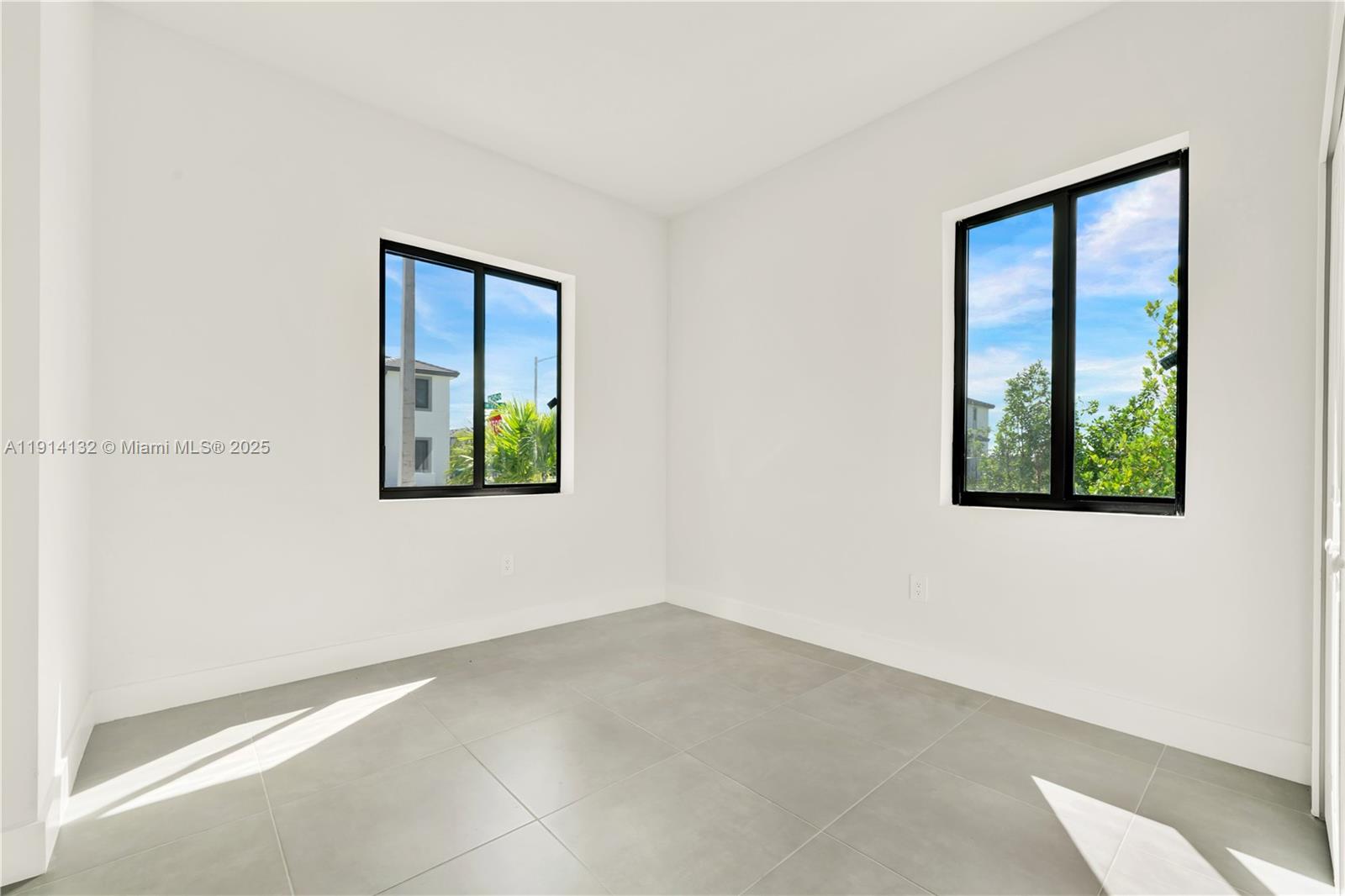 34520 Southwest 191st Court, Unit 34520 Homestead, FL 33034 - Photo 21 of 37 an empty room with windows