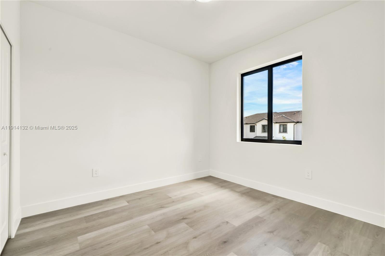 34520 Southwest 191st Court, Unit 34520 Homestead, FL 33034 - Photo 25 of 37 an empty room with a window