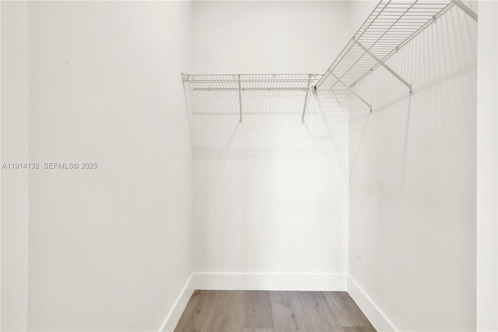 34520 Southwest 191st Court, Unit 34520 Homestead, FL 33034 - Photo 26 of 37 a view of a room with racks on the wall