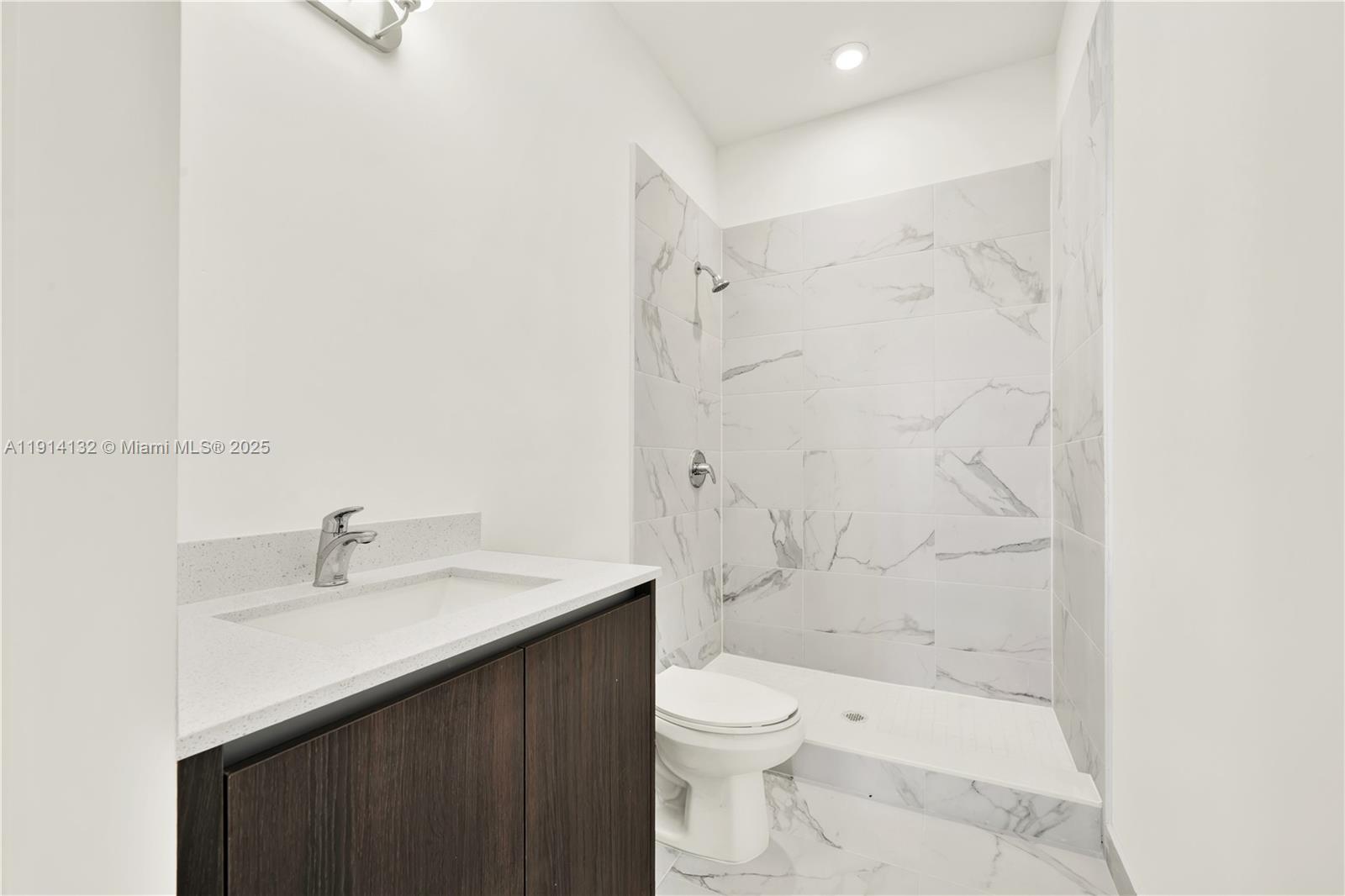 34520 Southwest 191st Court, Unit 34520 Homestead, FL 33034 - Photo 28 of 37 a bathroom with a sink toilet and shower