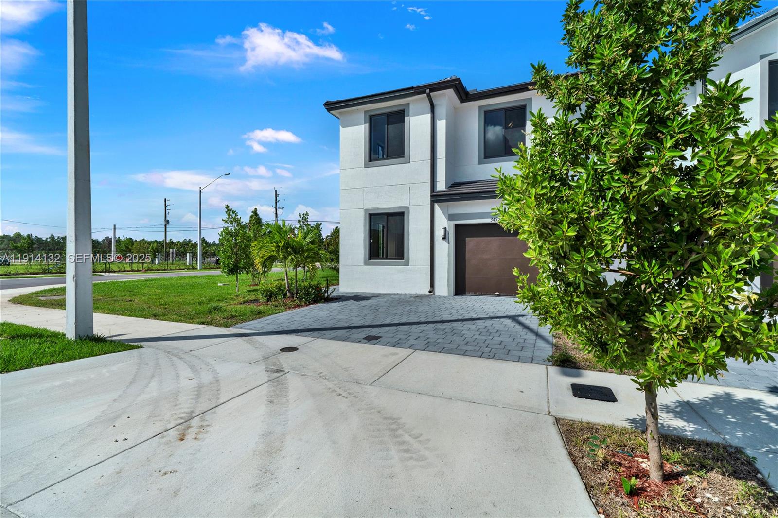 34520 Southwest 191st Court, Unit 34520 Homestead, FL 33034 - Photo 3 of 37 a house view with a garden space