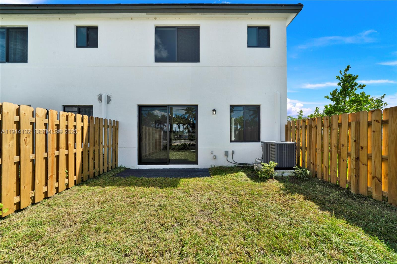34520 Southwest 191st Court, Unit 34520 Homestead, FL 33034 - Photo 34 of 37 a front view of a house with a yard