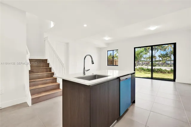 a kitchen with sink and window