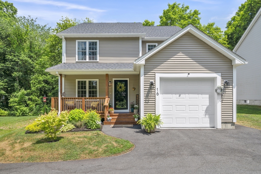 16 Farnum Street, Unit 16 Uxbridge, MA 01569 - Photo 1 of 34 a front view of a house with garden