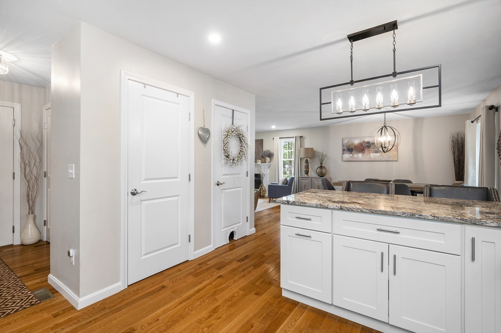 16 Farnum Street, Unit 16 Uxbridge, MA 01569 - Photo 12 of 34 a spacious bathroom with a granite countertop sink a mirror and shower